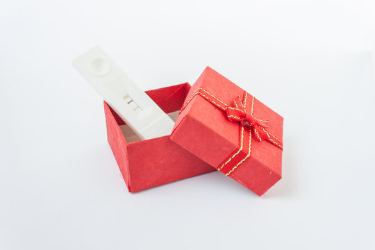pregnancy in red gift boxes on white background