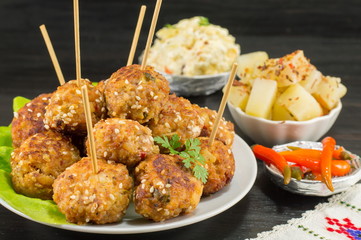 Meatballs on sticks decorated with vegetables