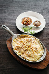 mexican cheese quesadilla with salsa and chilli sauce