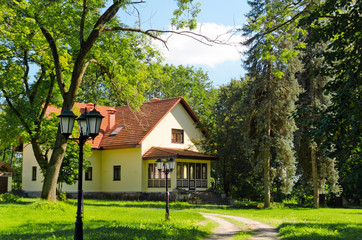Front of home of large single family modern house with landscape