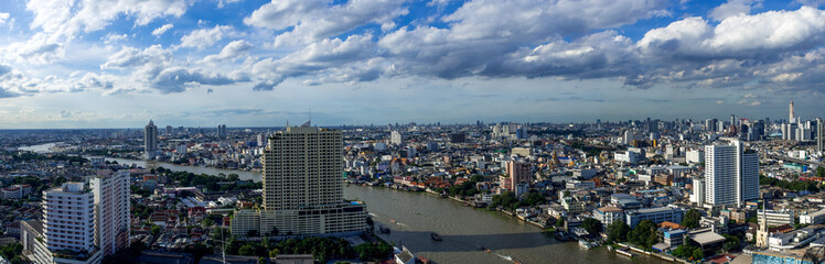 panoramic Bangkok cityscape with Chaopraya river on blue sky day - 120267309