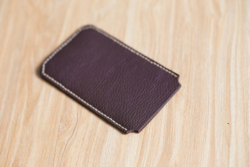 Leather crafting phone case handmade on wooden