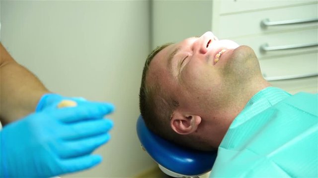 Dentist Prepares Material For Removal Of The Imprint Of Jaw