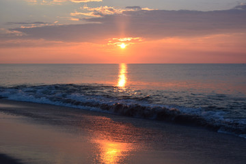 Reflective Summer Sunrise over the Sea