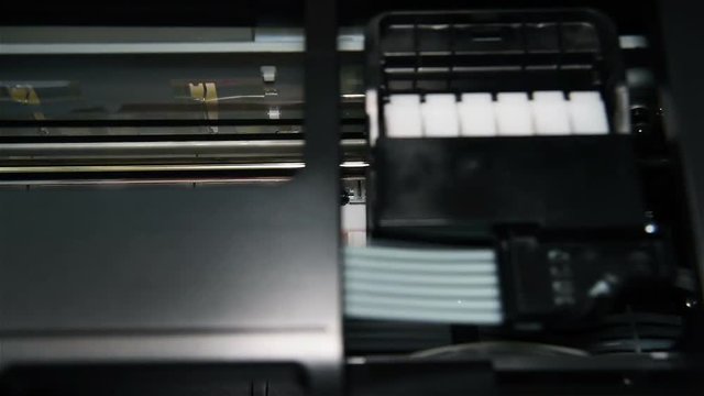 Black Printer Printing Photo. Extreme Close Up.