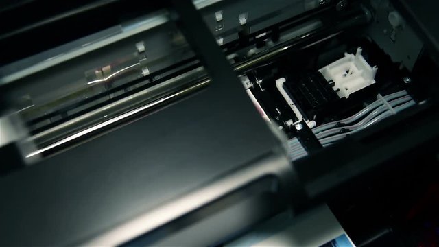Continuous Ink Feed Printer Printing Photo. Extreme Close Up.
