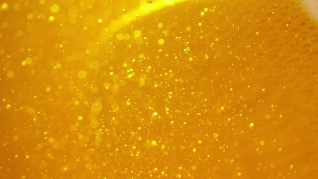 Spoon mix honey in a jar. Close up.
