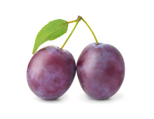 Two plums with leaf