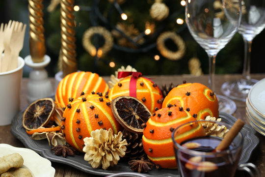 spiced orange pomander balls, scented christmas table decoration