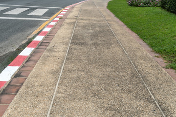Red and white concrete road curb