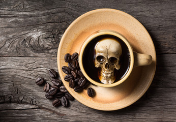 Still life photography : human skull soak in coffee cup in harmful effect from Caffeine concept
