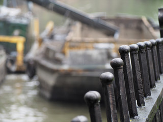 fence, dredging the river
