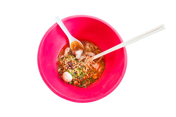Asian noodle soup in a red bowl  Isolated on white background,Spicy noodle,tom-yum-noodles, Top view