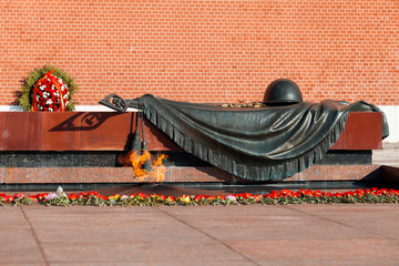 Tomb of Unknown soldier and Eternal flame in Alexander garden near Kremlin wall in Moscow, Russia