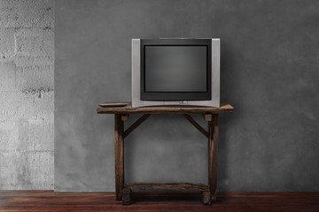 obsolete tv on old wooden in empty living room