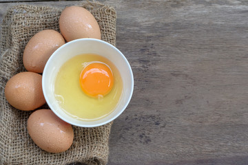 Fresh eggs on a wooden background
