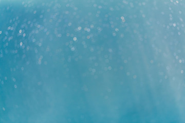 Abstract Light blue bokeh water with light