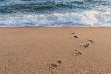 Footprints on the sand beach