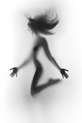Beautiful and sexy woman body silhouette, flying hair