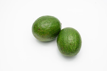 Green avocados isolated on a white background