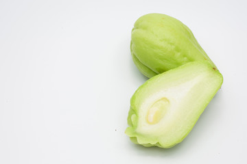 Sliced fresh Chayote and half isolated on white background.