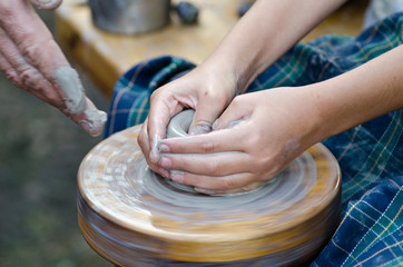 potter's wheel and a piece of clay