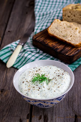 Multigrain bread,dill  and spiced yoghurt on rustic background.