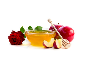 Honey, red apples and red rose on a white background