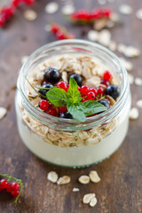 yogurt with berries and products for healthy breakfast, close-up
