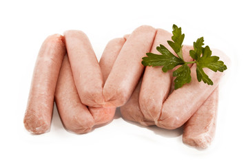 scottish sausages with parsley on white