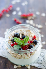 yogurt with berries and products for healthy breakfast, close-up
