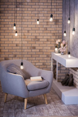 Cozy place for reading on chair in front of modern fireplace in loft style 