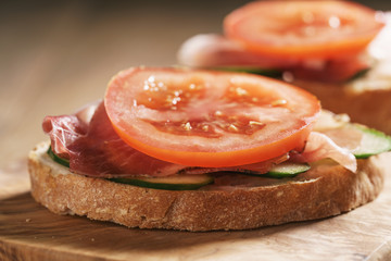 ciabatta open sandwiches with speck and vegetables