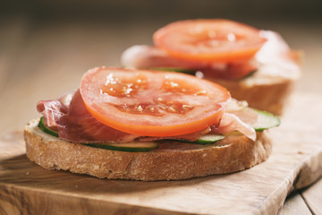 ciabatta open sandwiches with speck and vegetables