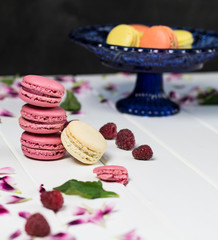 Macaroon on a white wooden background, vertical, selective focus