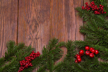 Naklejka na ściany i meble Christmas fir tree on wooden background