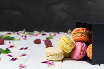Macaroon on a white wooden background, horizontal, selective focus