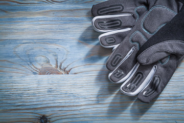 Safety gloves on wooden board gardening concept