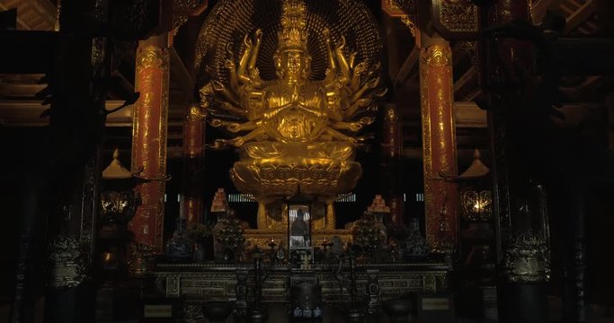 Quan Am Buddhist statue and altar decoration in Bai Dinh Temple in Vietnam. Spiritual tourism
