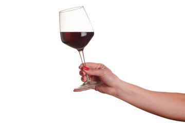 main féminine avec un verre de vin rouge