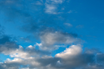 clouds fill the blue sky