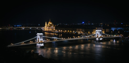 Fototapeta na wymiar Night cityscape panorama of Budabest, capital of Hungary. Chain Bridge nicely illuminated.