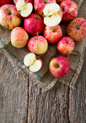 apples on wooden surface