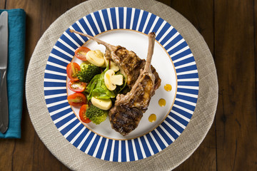 Rare fried rack of lamb with vegetables.