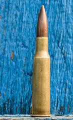 7.62mm Bullet and Wooden Background