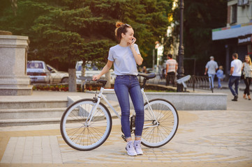 girl with Bicycle talking on the phone
