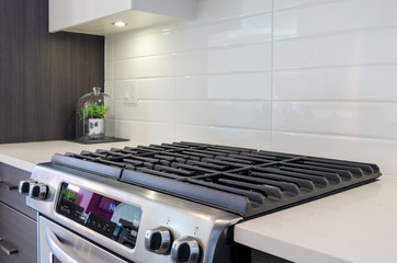 Fragment of a modern kitchen with a gas stove.
