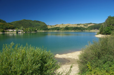 Fototapeta na wymiar View of Brasimone Lake and its dam.