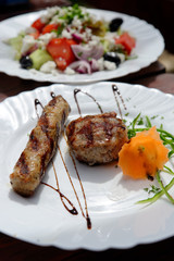 Kebapche and kyufte - a traditional Bulgarian dish of grilled minced meat with spices.