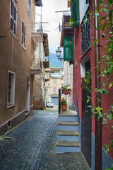 Fototapeta na wymiar Narrow medieval street in town of Ormea, Italy